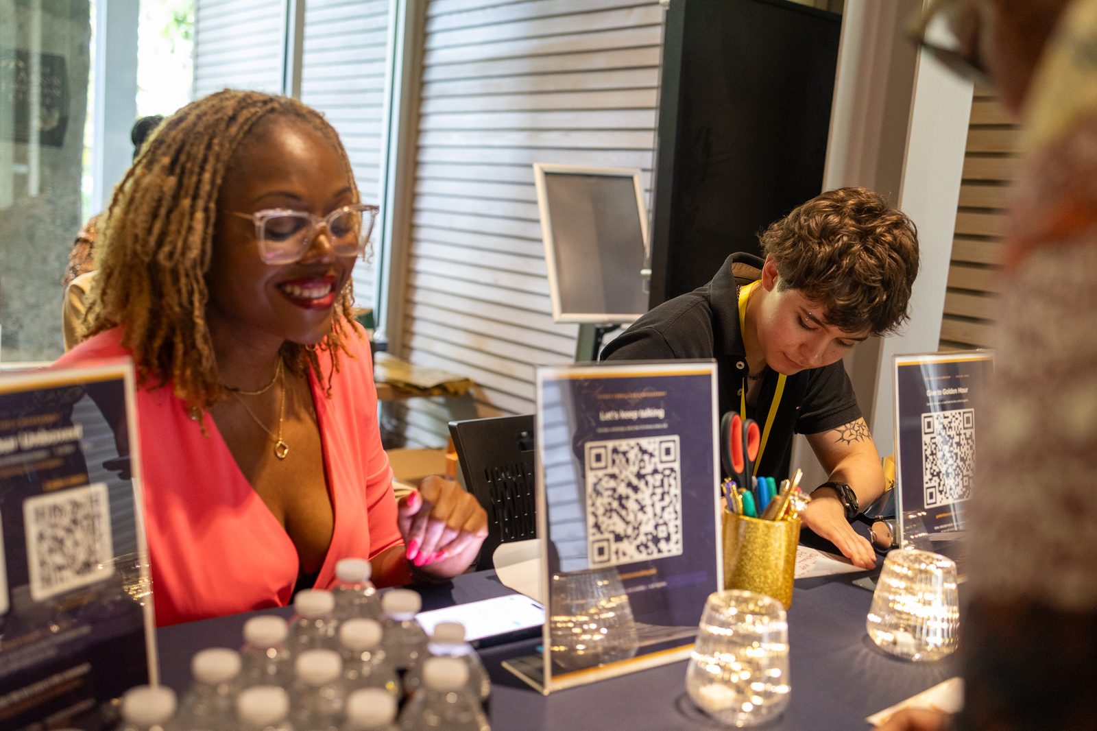 Dar'Nesha Love-Bowman and Jane Stratton at the registration table. Volunteers.