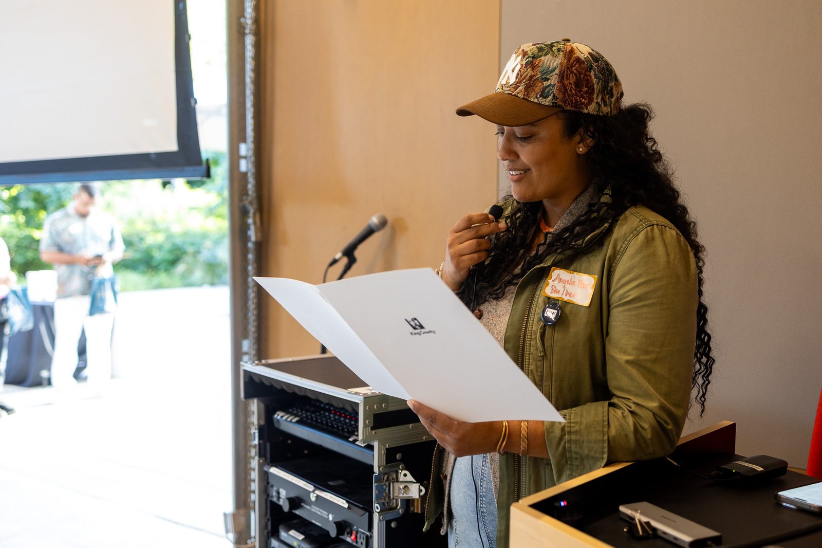 Angela Phan reads the King County proclamation. East King County Relations Manager, King County Executive's Office.